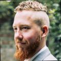 John Doyle profile image: man with red hair and beard