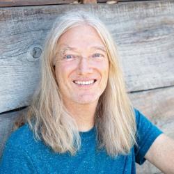 Christoph Weber profile image: man with grey long hair wearing a blue T-shirt